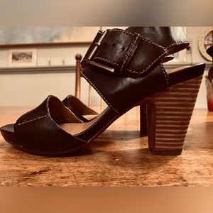 Black leather wooden heeled sandals by Clark’s